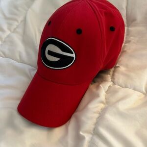 Red baseball cap, UGA University of Georgia Bulldogs, one fit top of the world